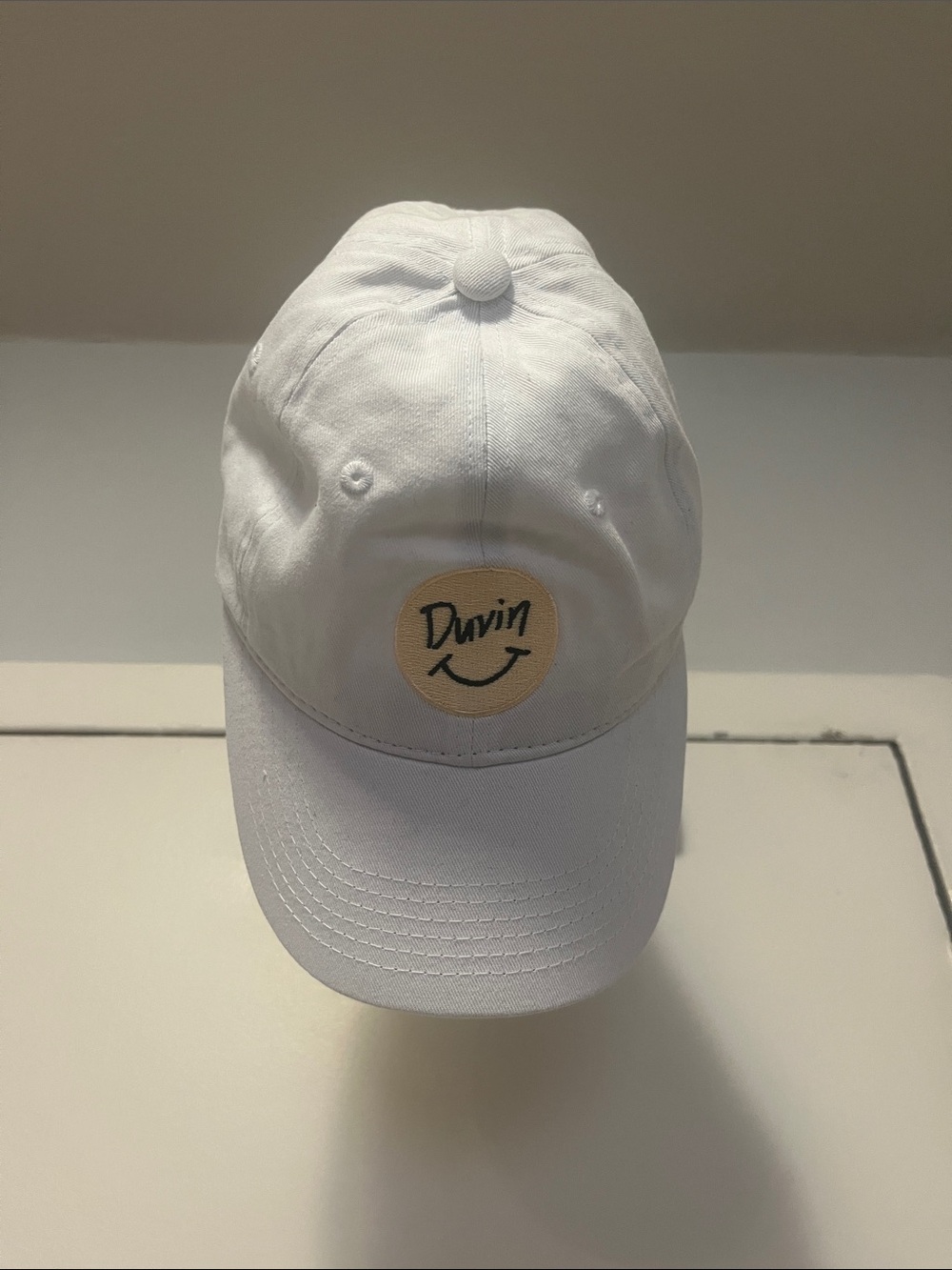 Duvin White Smiley Logo Baseball Cap